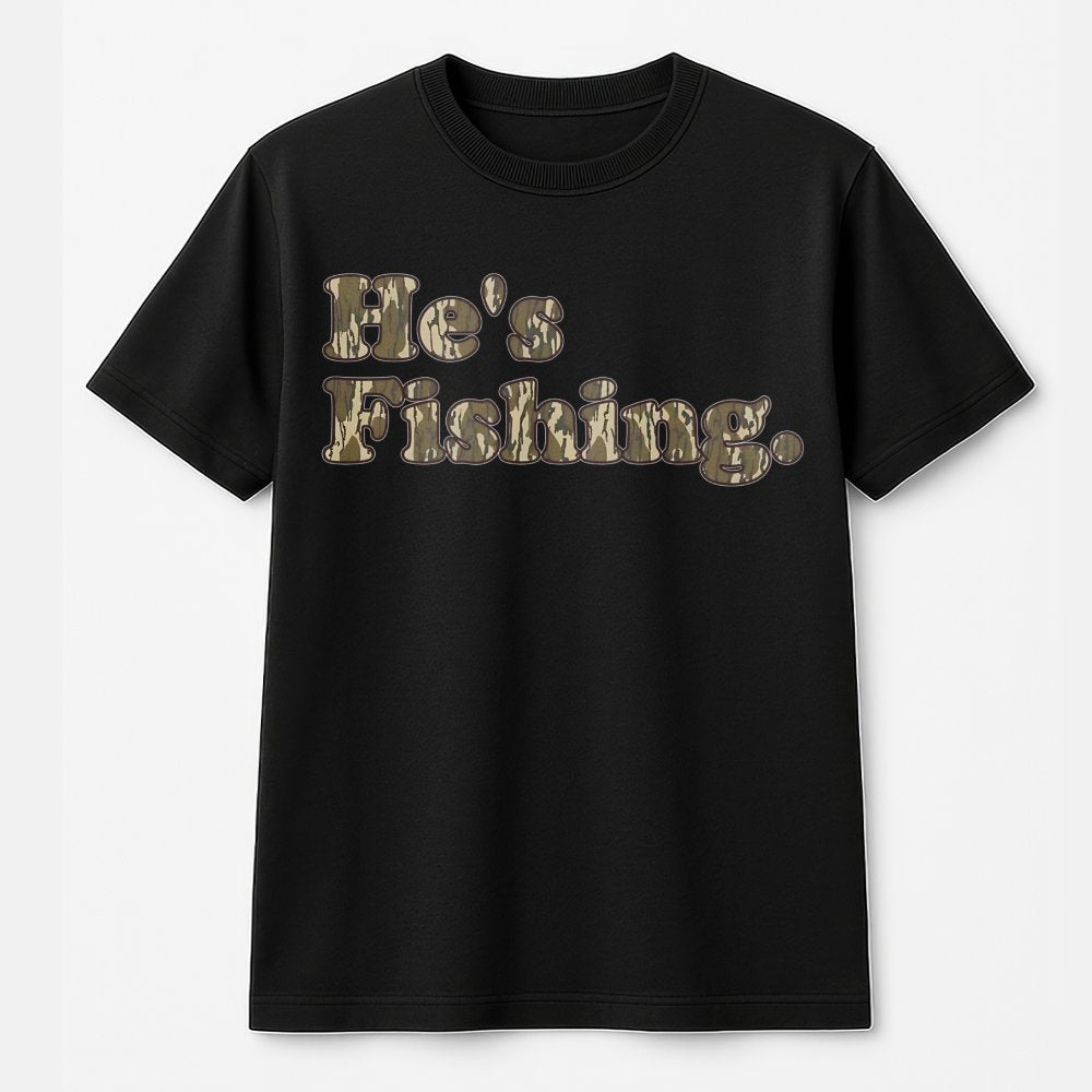He's Fishing T-Shirt | Camo Text Graphic Design | Premium Cotton Tee | Gift for Anglers and Outdoorsmen