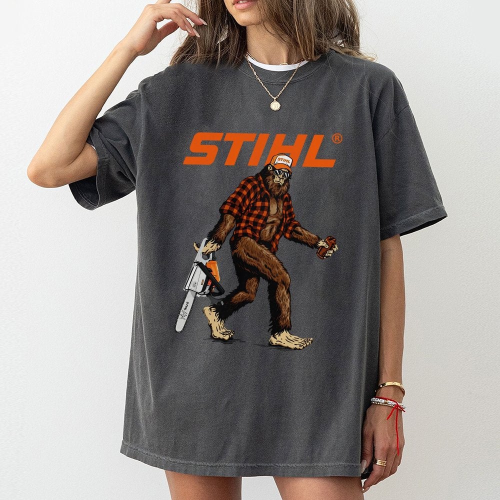 Bigfoot With Chainsaw Graphic T-Shirt | Retro Lumberjack Sasquatch Print | Premium 100% Cotton Tee | Gift for Woodsman and Ou