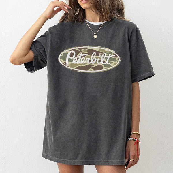 Peterbilt Truck Graphic T-Shirt | Camo Oval Logo Design | Premium 100% Cotton | Retro Heritage Gift for Truckers and Heavy Du